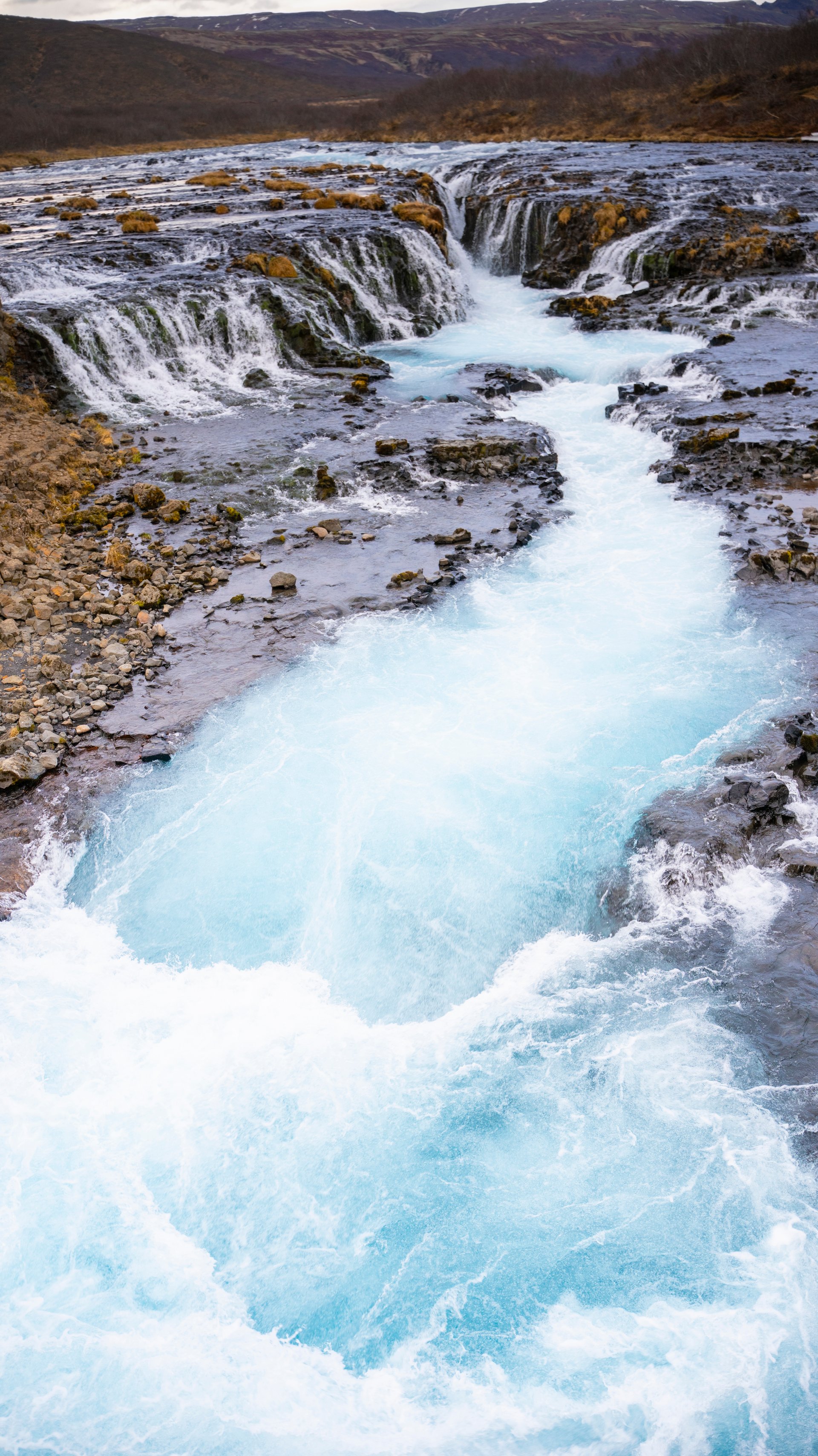 Brúarfoss cascades splitting through rock formations