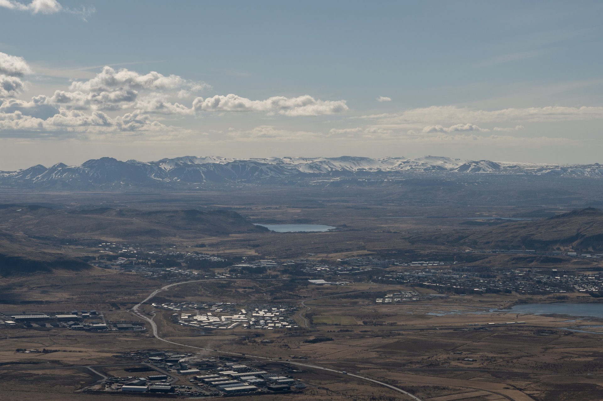 Mount Esja seen from a distance with the Reykjavík skyline in the foreground
