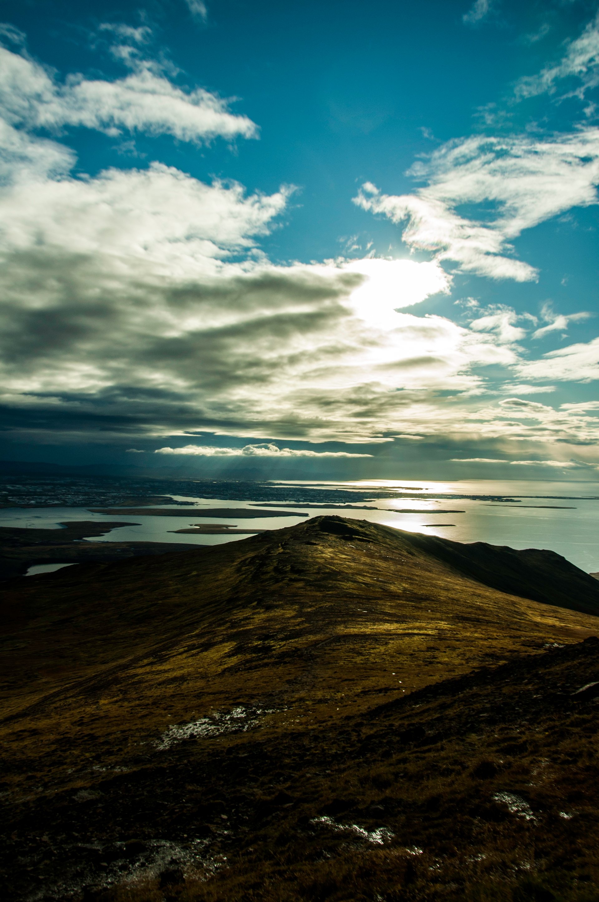Summit view from Mount Esja overlooking the bay and surrounding mountains