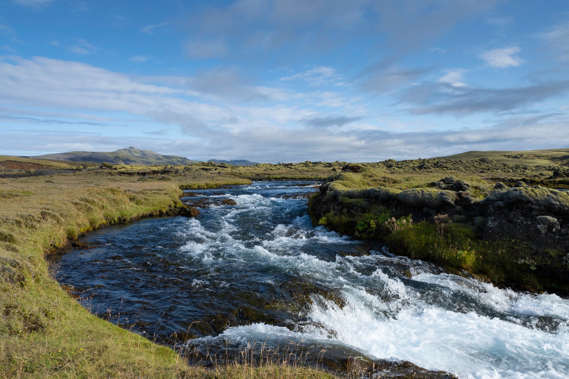 Super jeep navigating the rugged F208 highland road through volcanic terrain