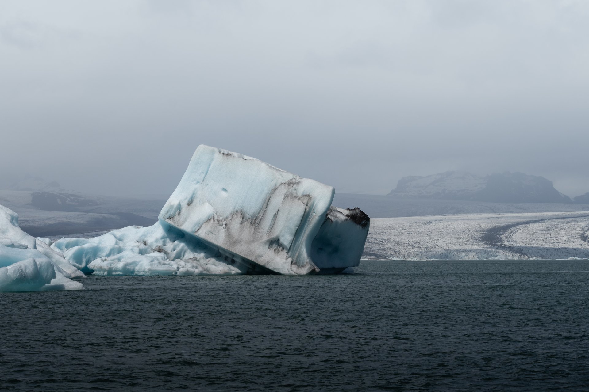 Jökulsárlón glacier lagoon with floating icebergs and blue ice