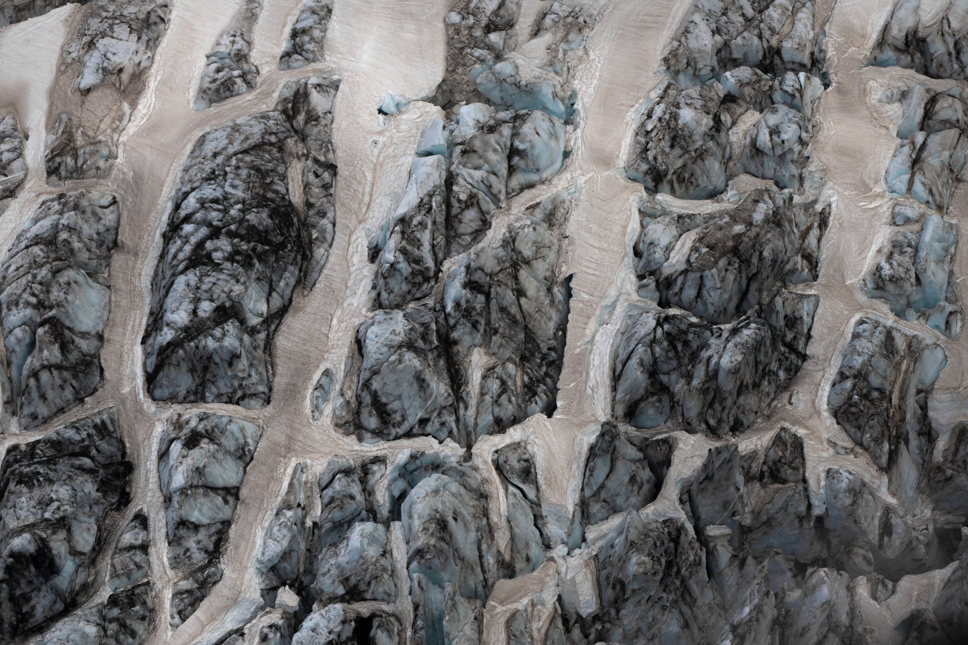 Ice cap aerial photography showing blue ice and snow from above