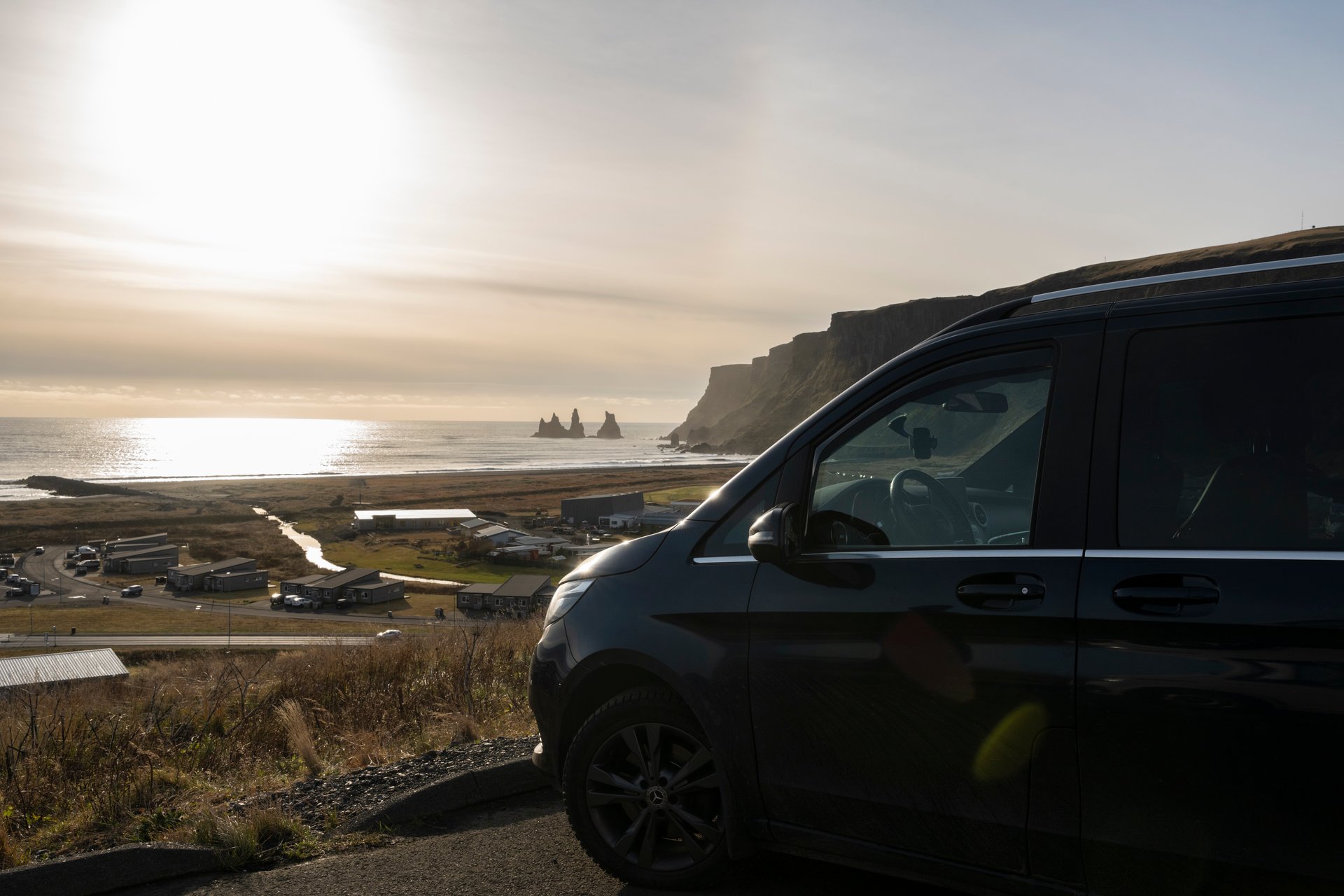 Driving in Iceland with open road and mountain scenery