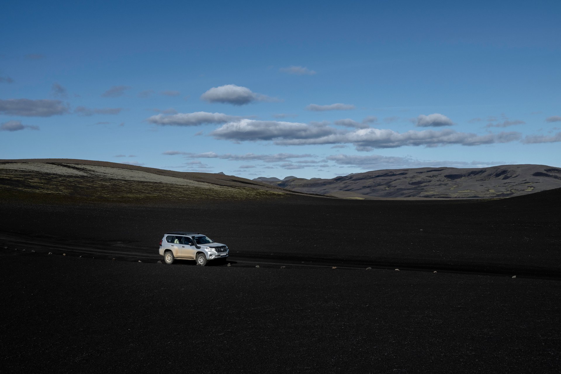 Scenic road winding through Iceland's dramatic volcanic landscape
