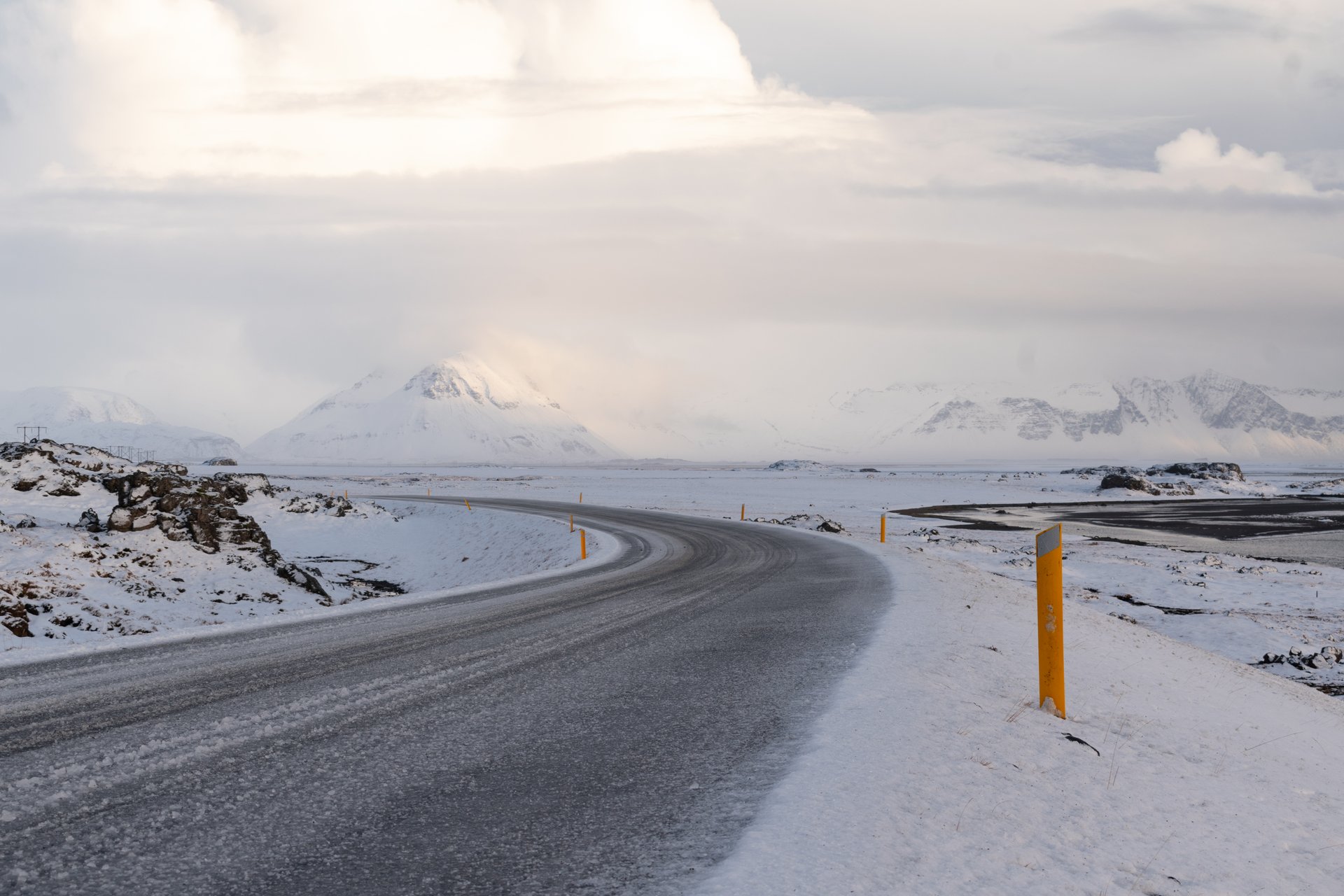 Scenic Icelandic road stretching through volcanic landscape