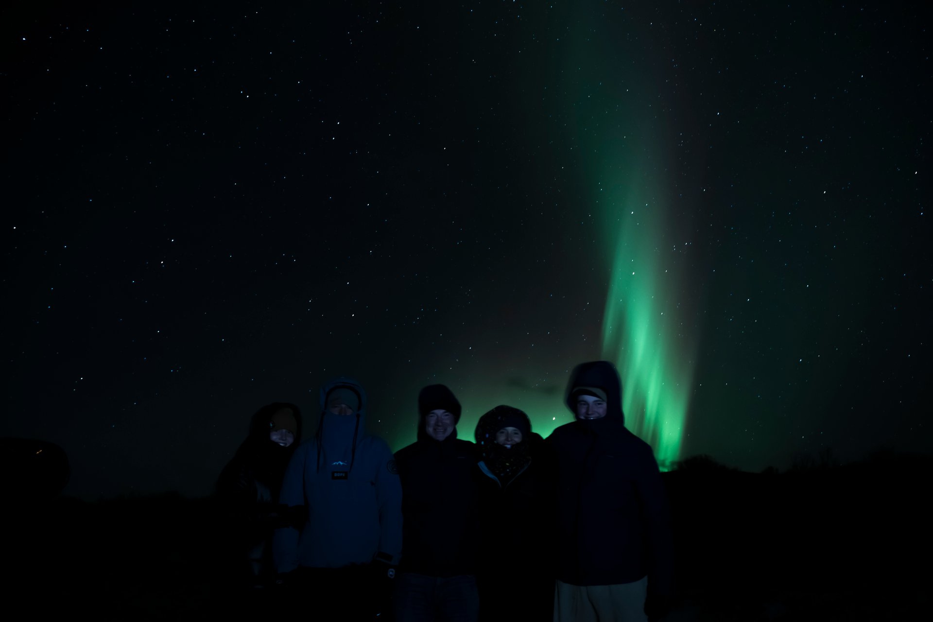 Northern Lights dancing over Iceland with green and purple hues
