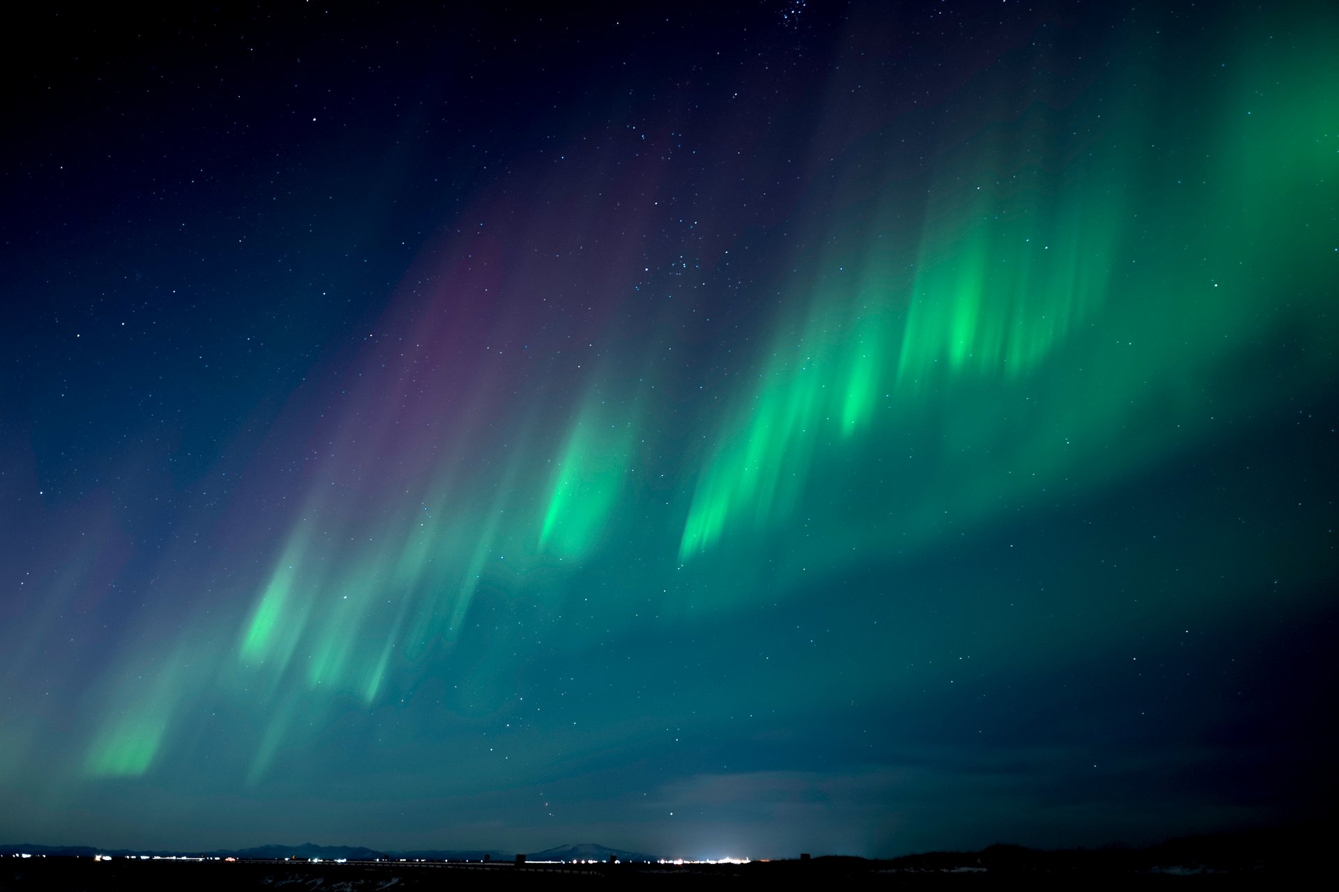 Vivid aurora borealis illuminating the Icelandic night sky