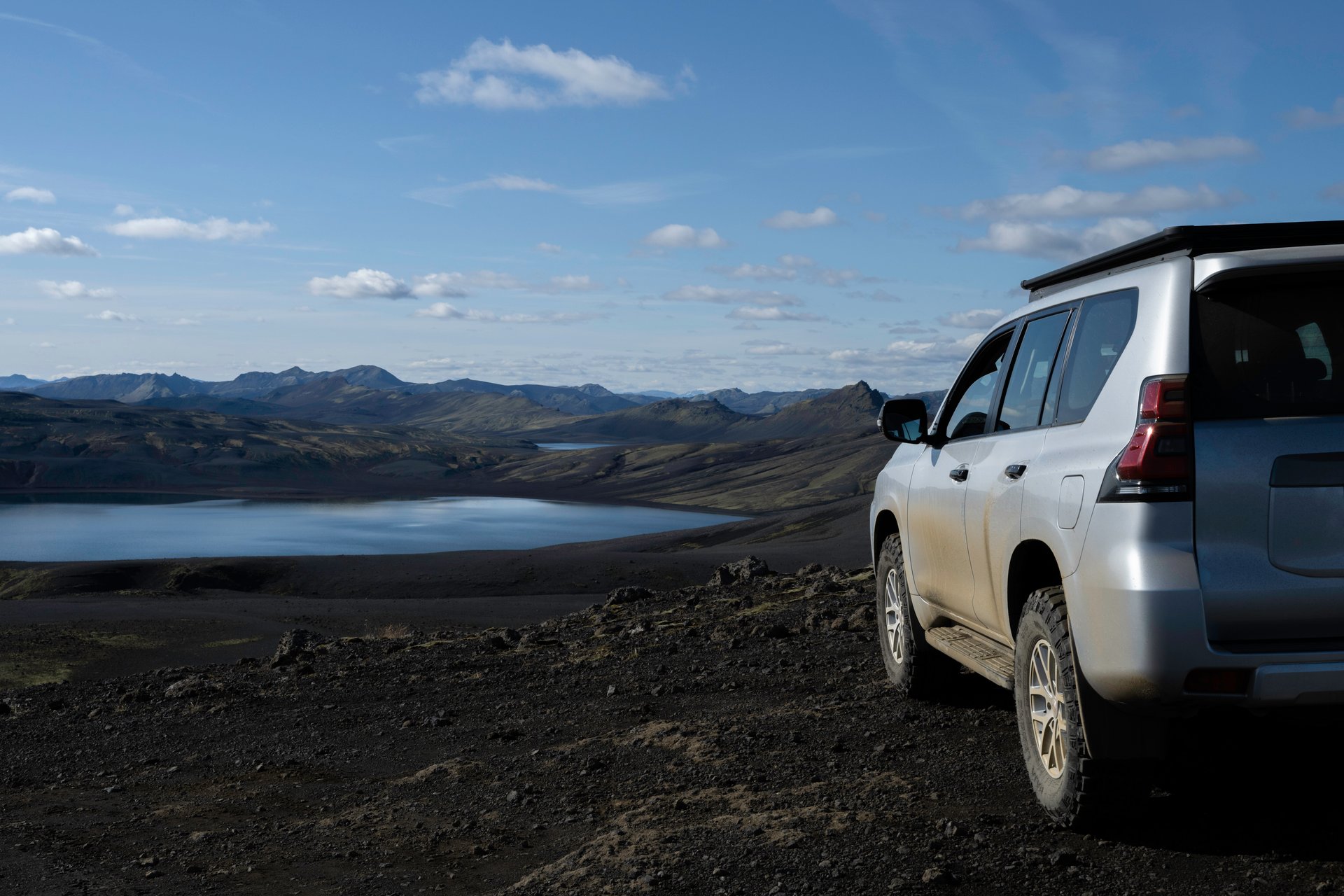 Iceland road stretching through volcanic landscape representing the new kilometer tax system