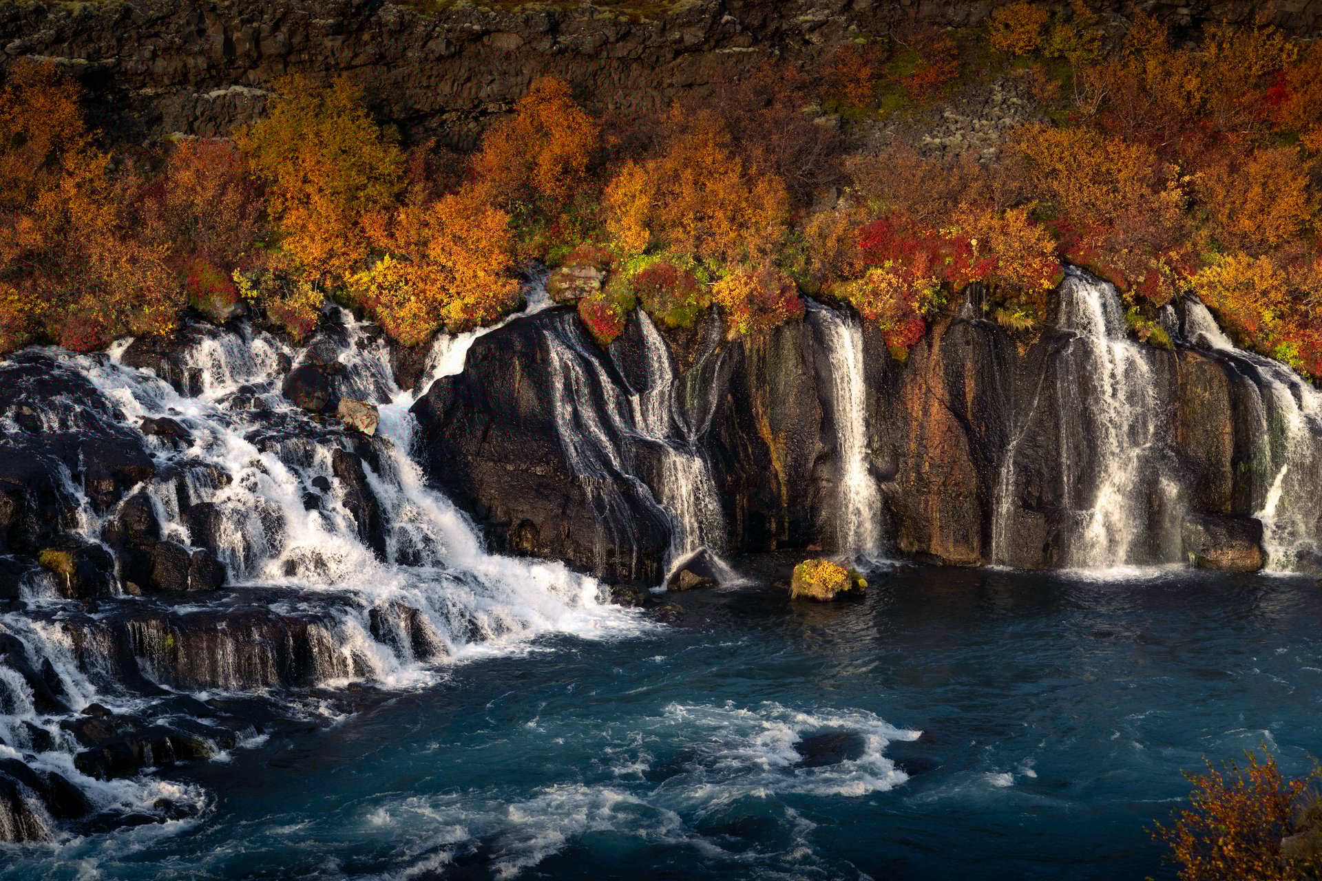 Late afternoon light on Hraunfossar's countless cascading streams