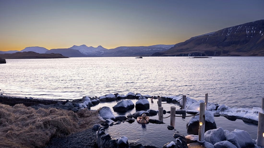 Hvammsvík Hot Springs oceanside pools with mountain and fjord views