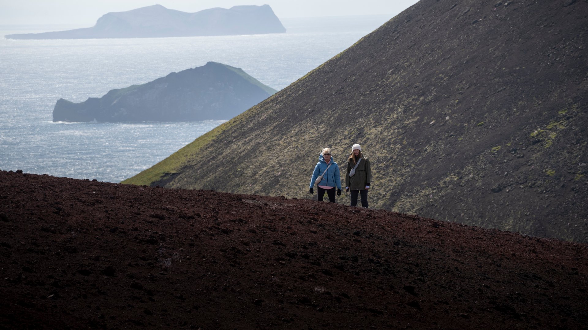 View from the summit of Eldfell over Heimaey town and harbour, Westman Islands Iceland