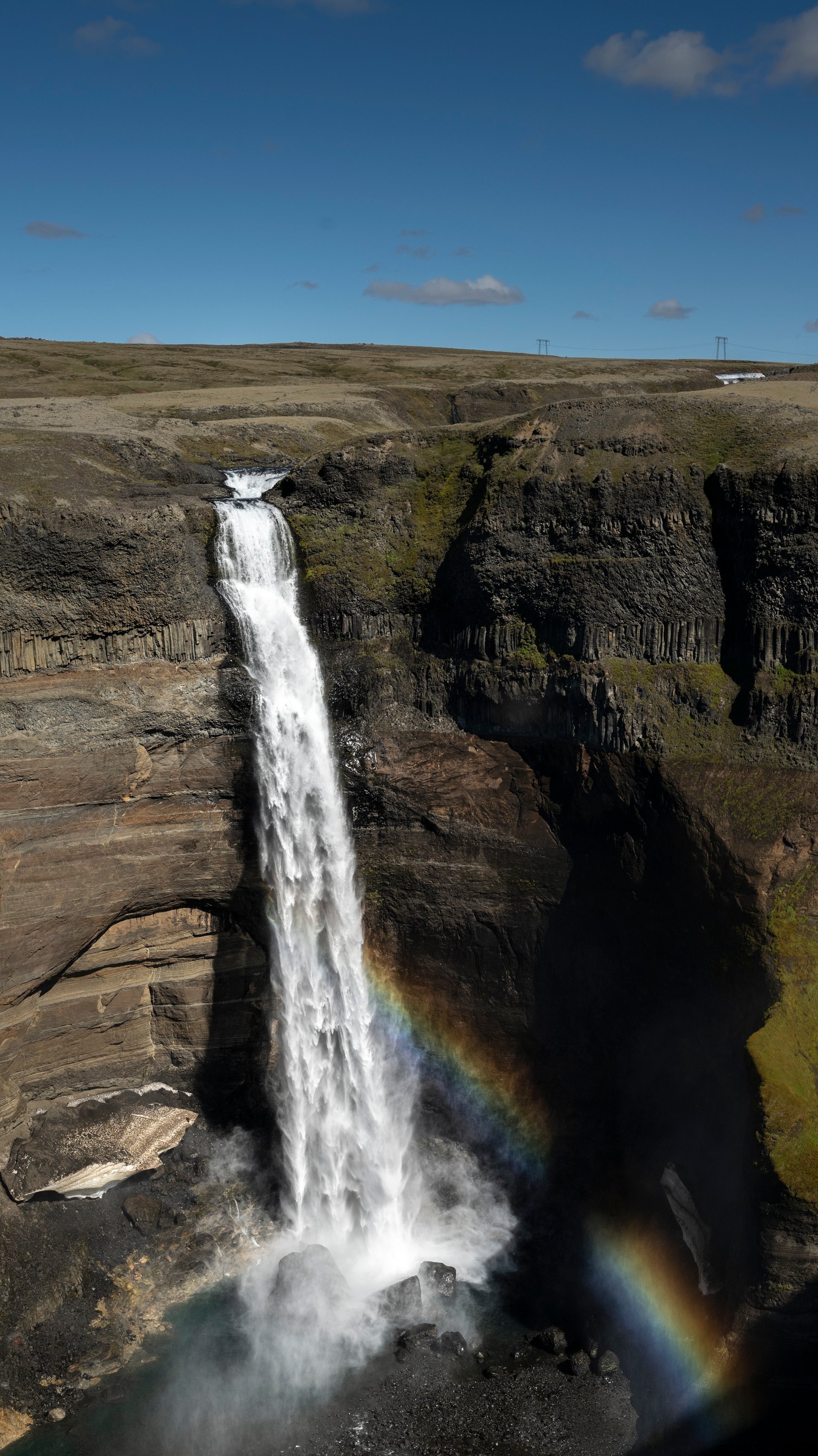 Háifoss waterfall dropping in a single thin line into a green highland canyon, Þjórsárdalur Iceland