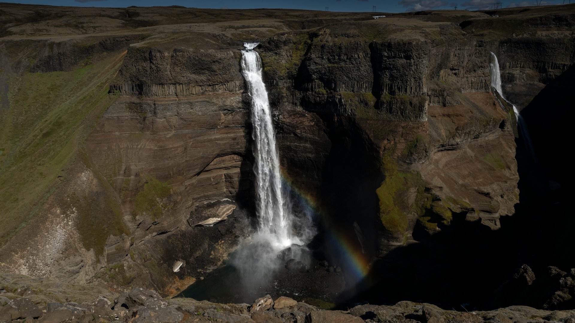 Háifoss and its neighbour Granni in the highland canyon in June, Iceland