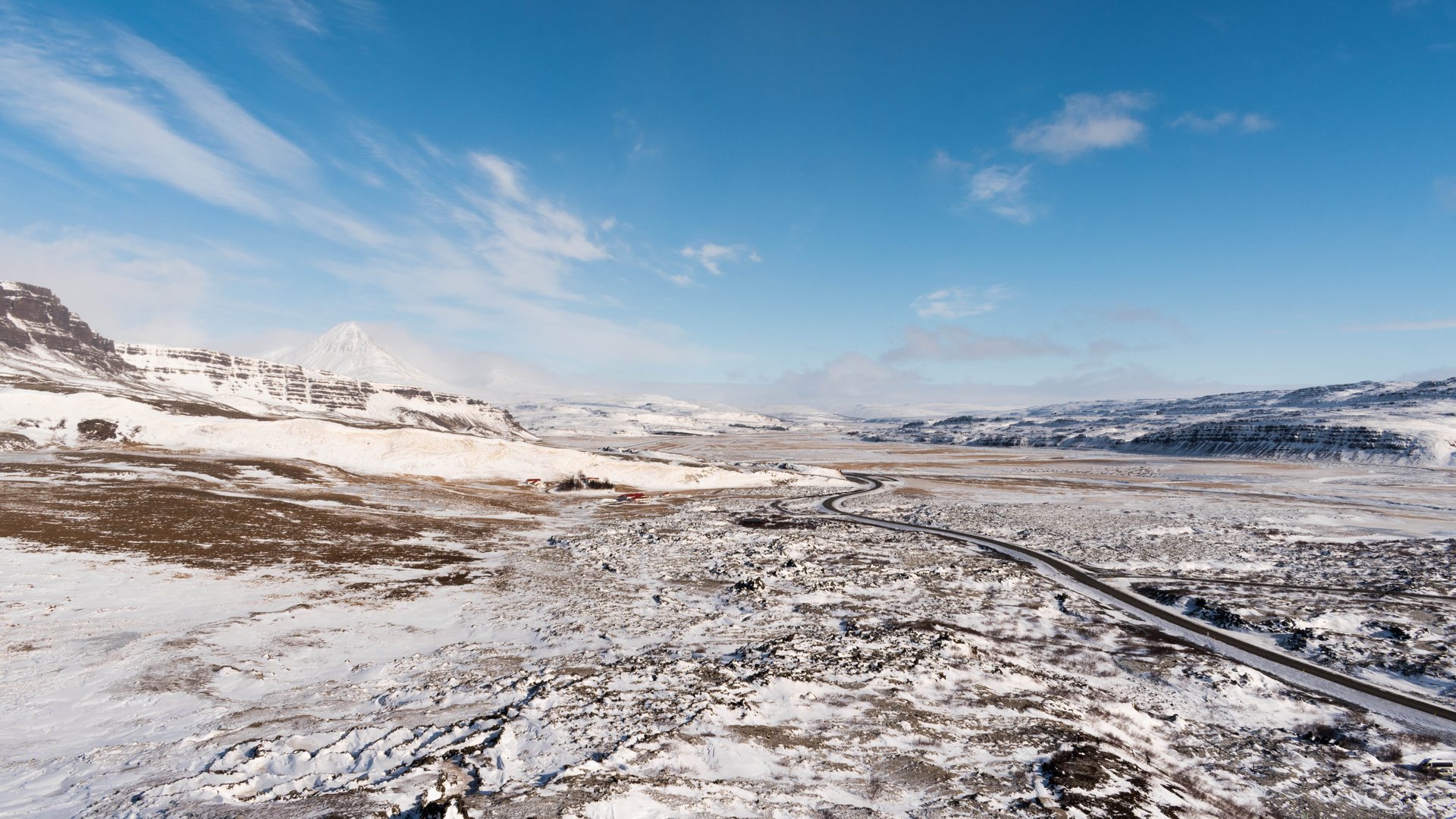 View from Grábrók crater rim overlooking the lava field and mountains