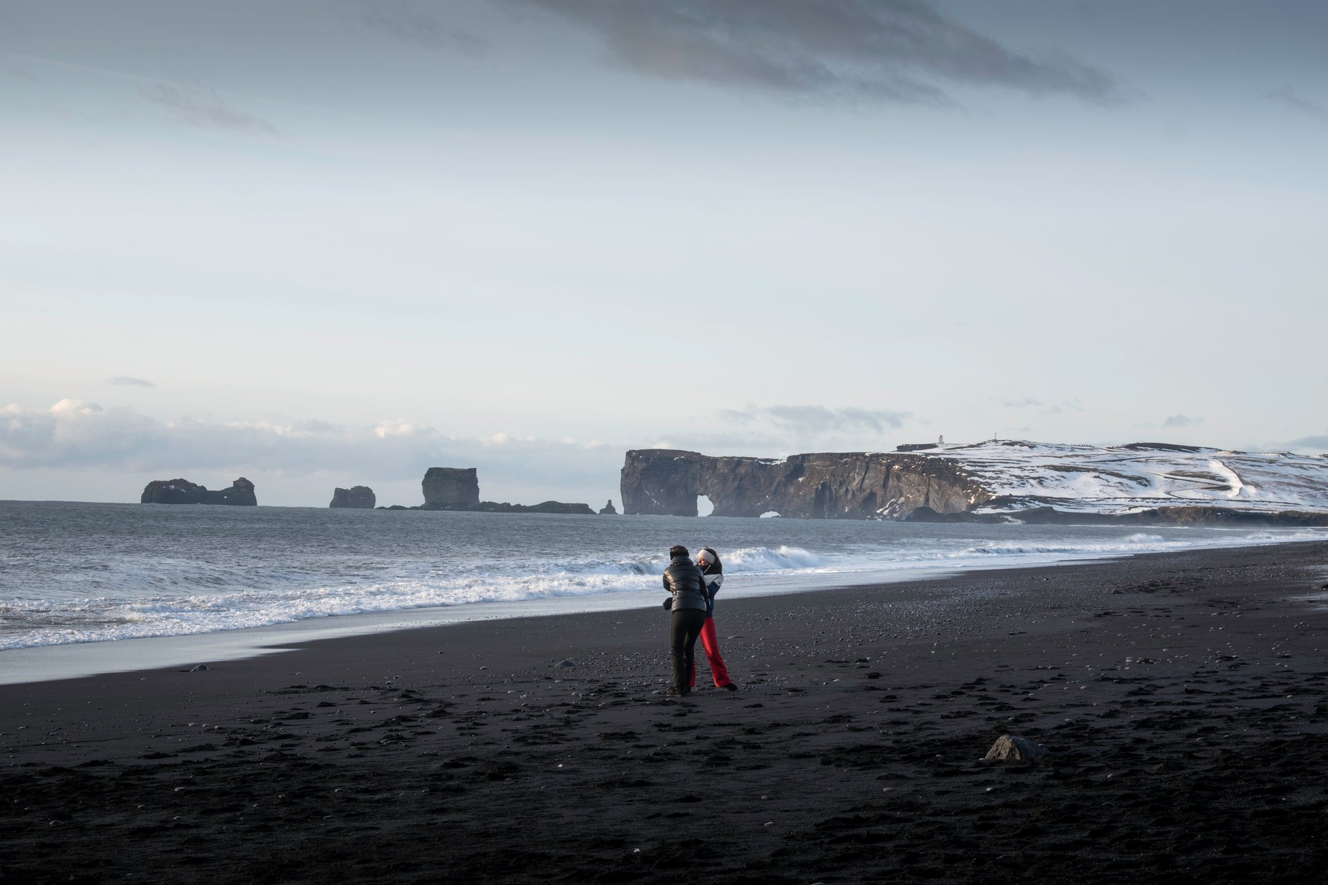 Reynisfjara beach showing the wide stretch of black sand before the erosion