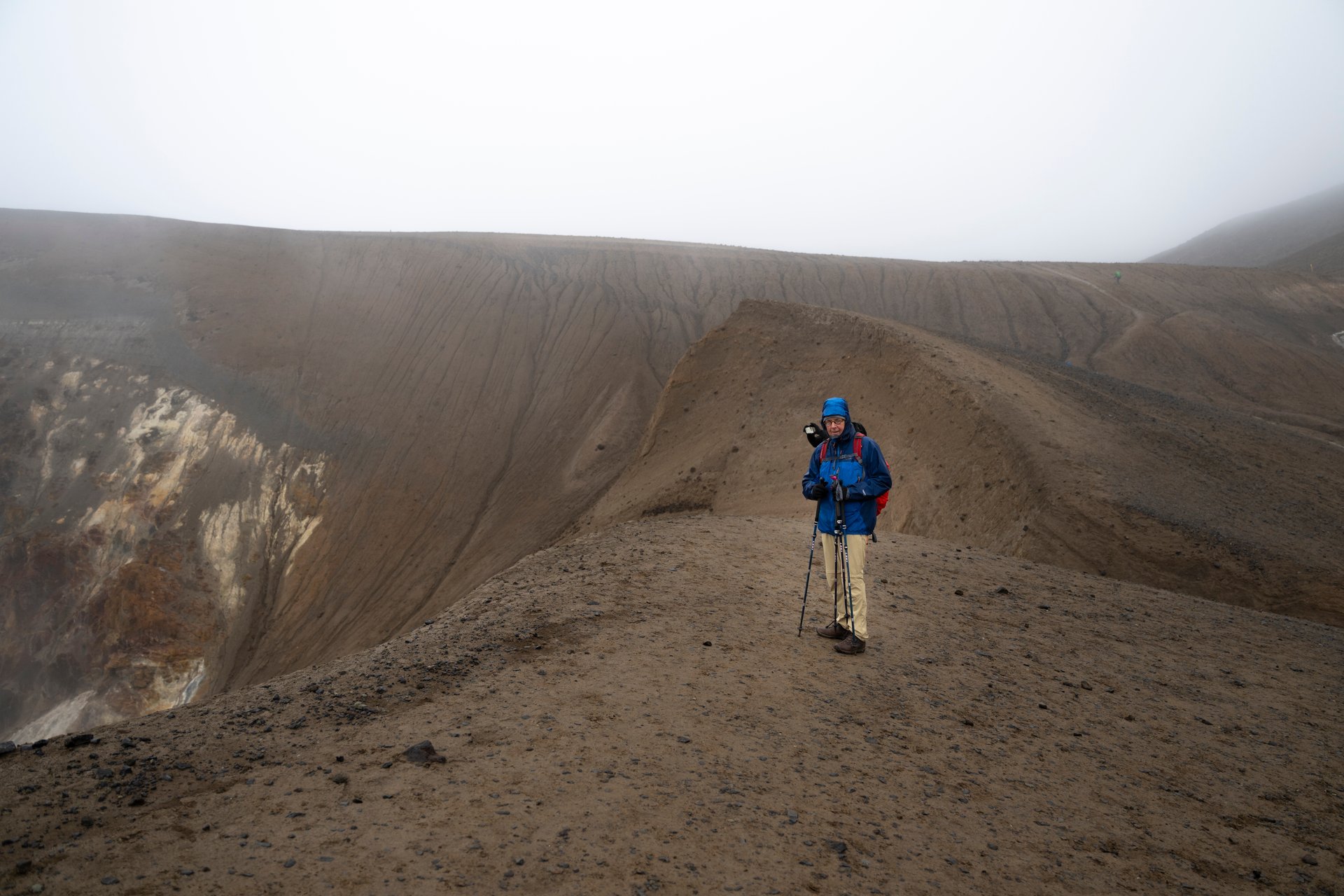 Client on a hiking tour in bad weather — proof that proper gear makes all the difference