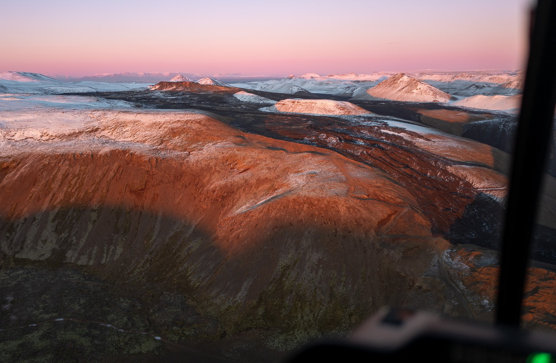 Dramatic volcanic landscape with steam and lava formations