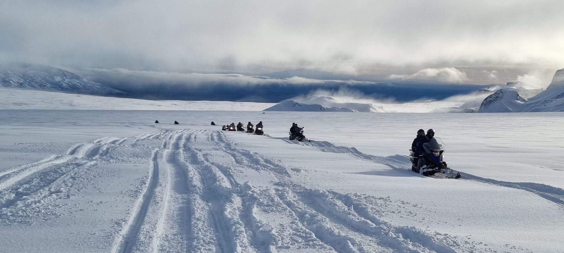 Panoramic mountain views from Langjökull ice cap snowmobile tour