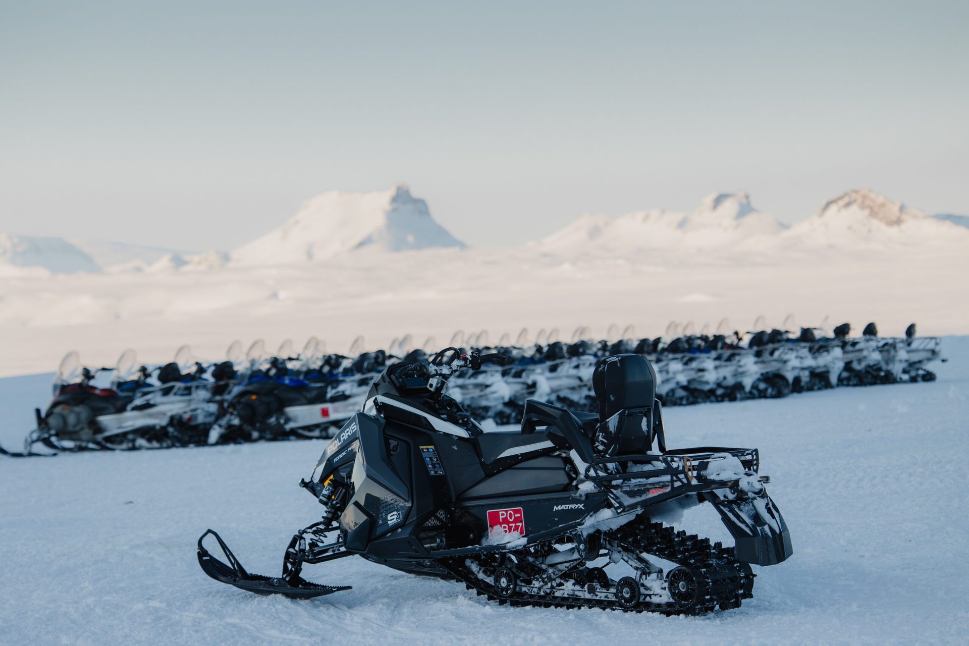 Group snowmobiling adventure on pristine Langjökull ice cap