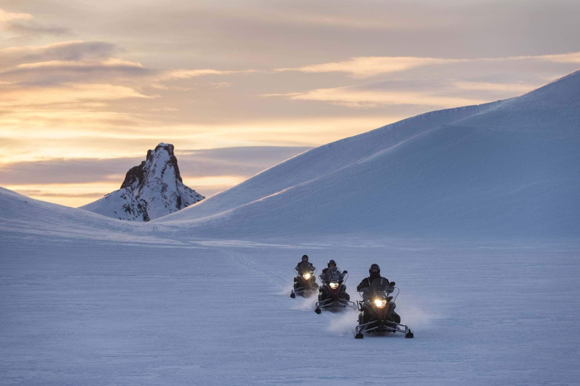 High-speed snowmobiling on pristine Langjökull glacier with mountain panoramas