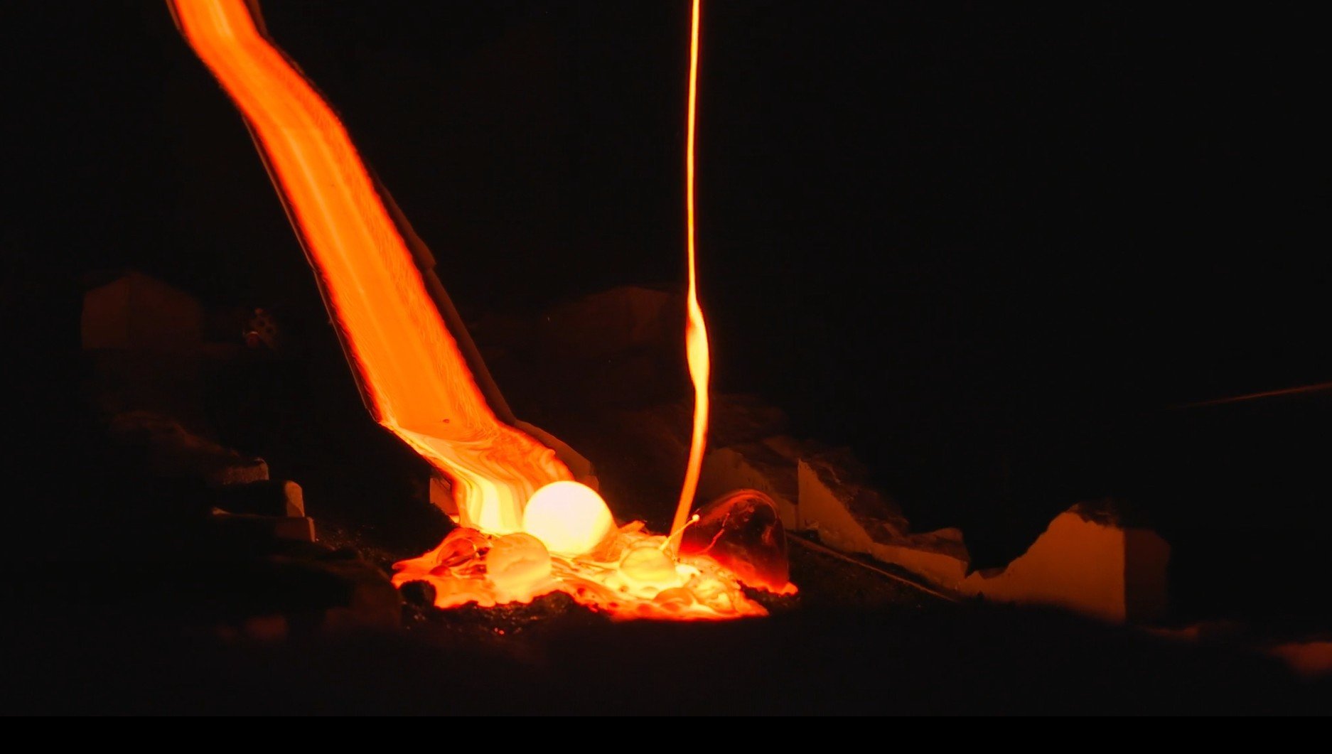 Real molten lava flowing at 1100°C during live demonstration in Reykjavík