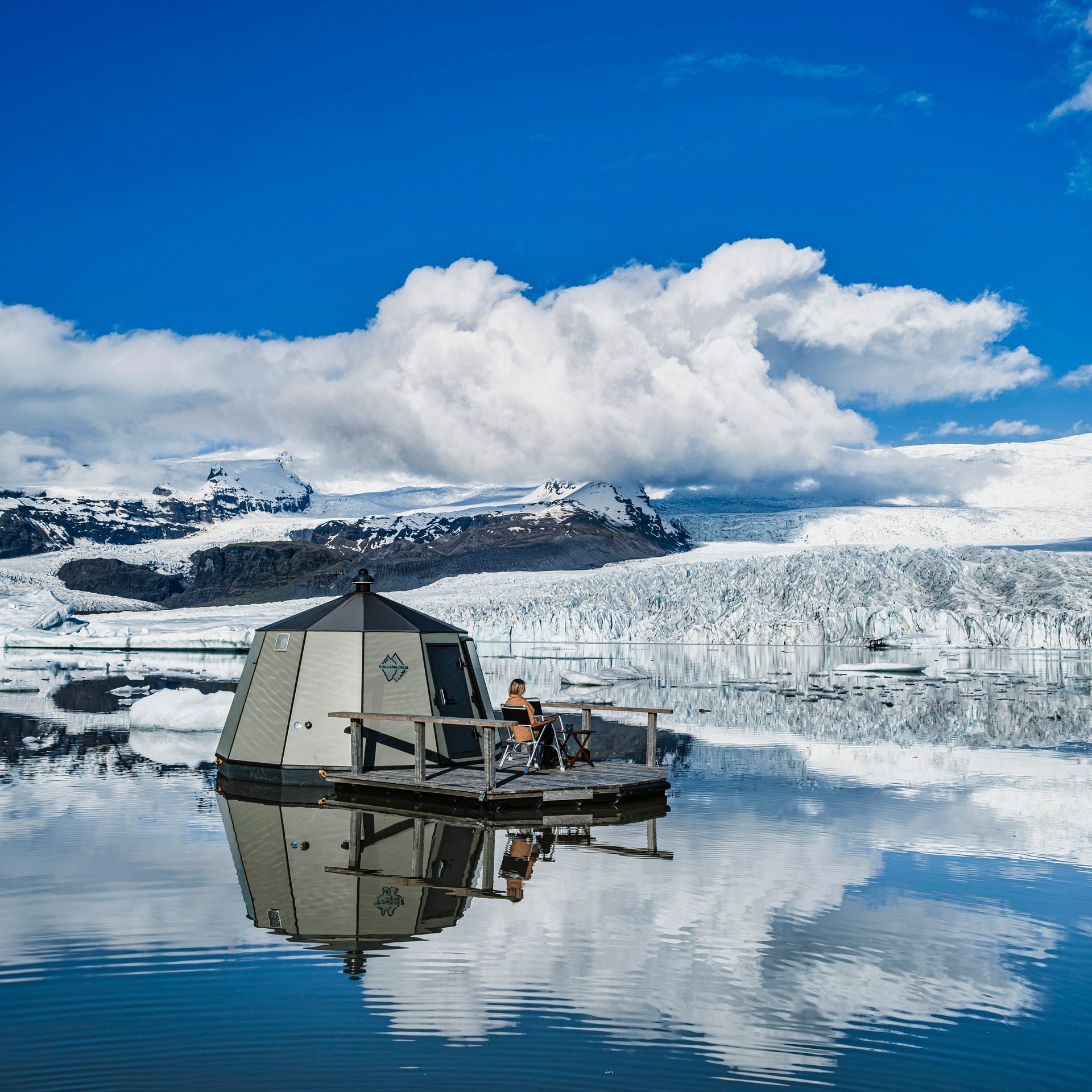 Luxury double bed inside Hut with Vatnajökull Glacier backdrop