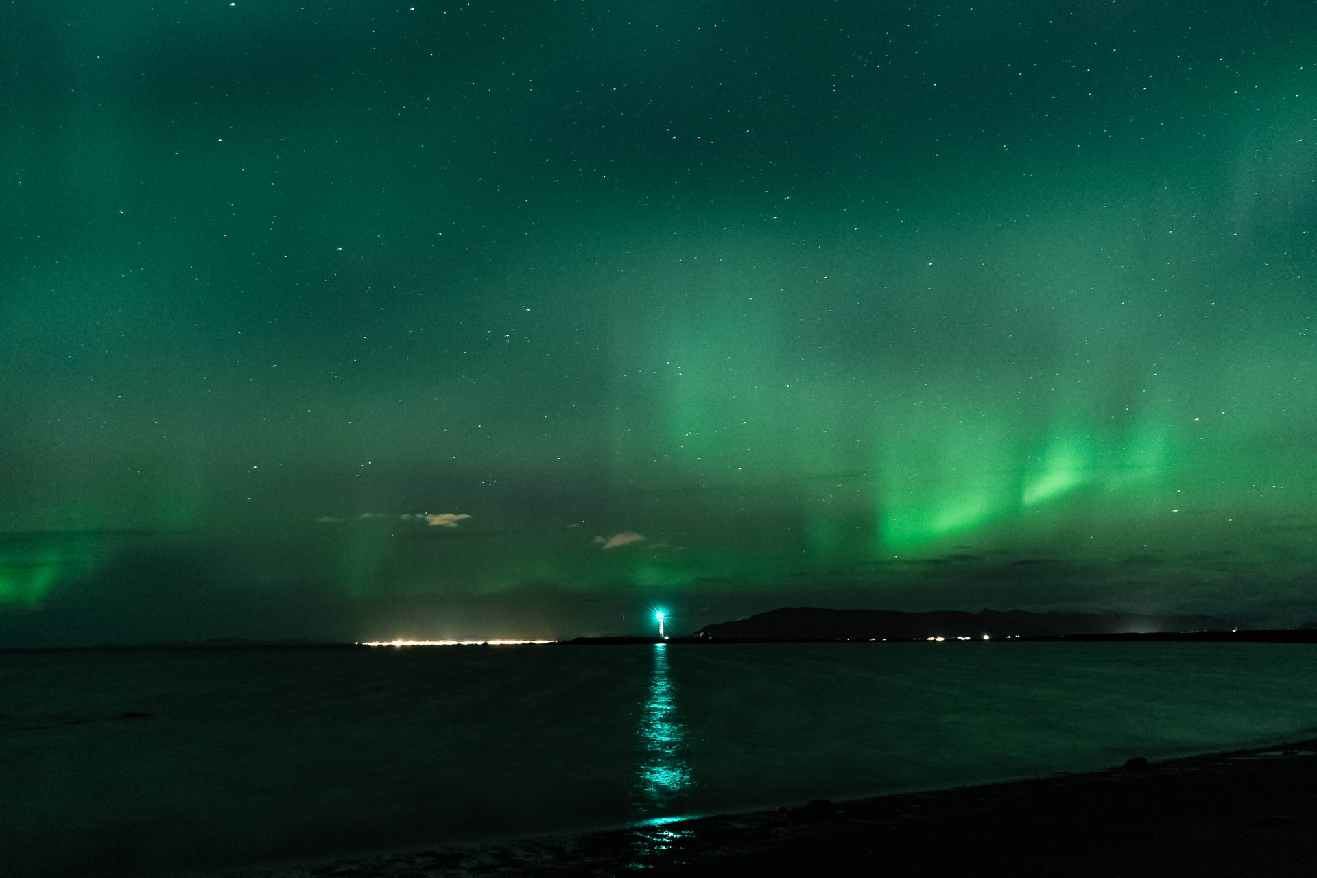 Guests viewing magnificent Northern Lights from dark sky location in Iceland