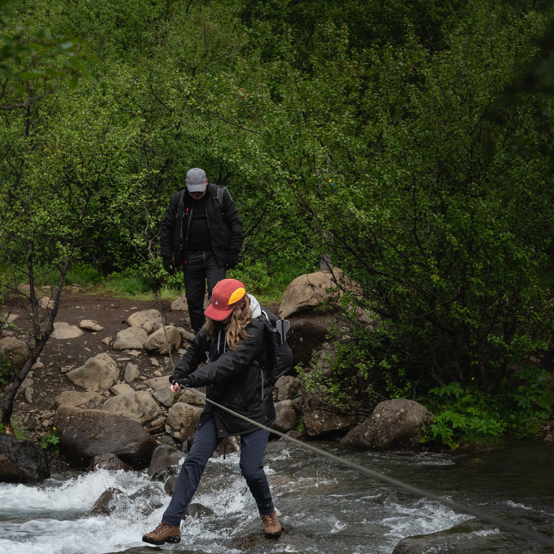 Spectacular 198-meter Glymur waterfall cascading through narrow canyon