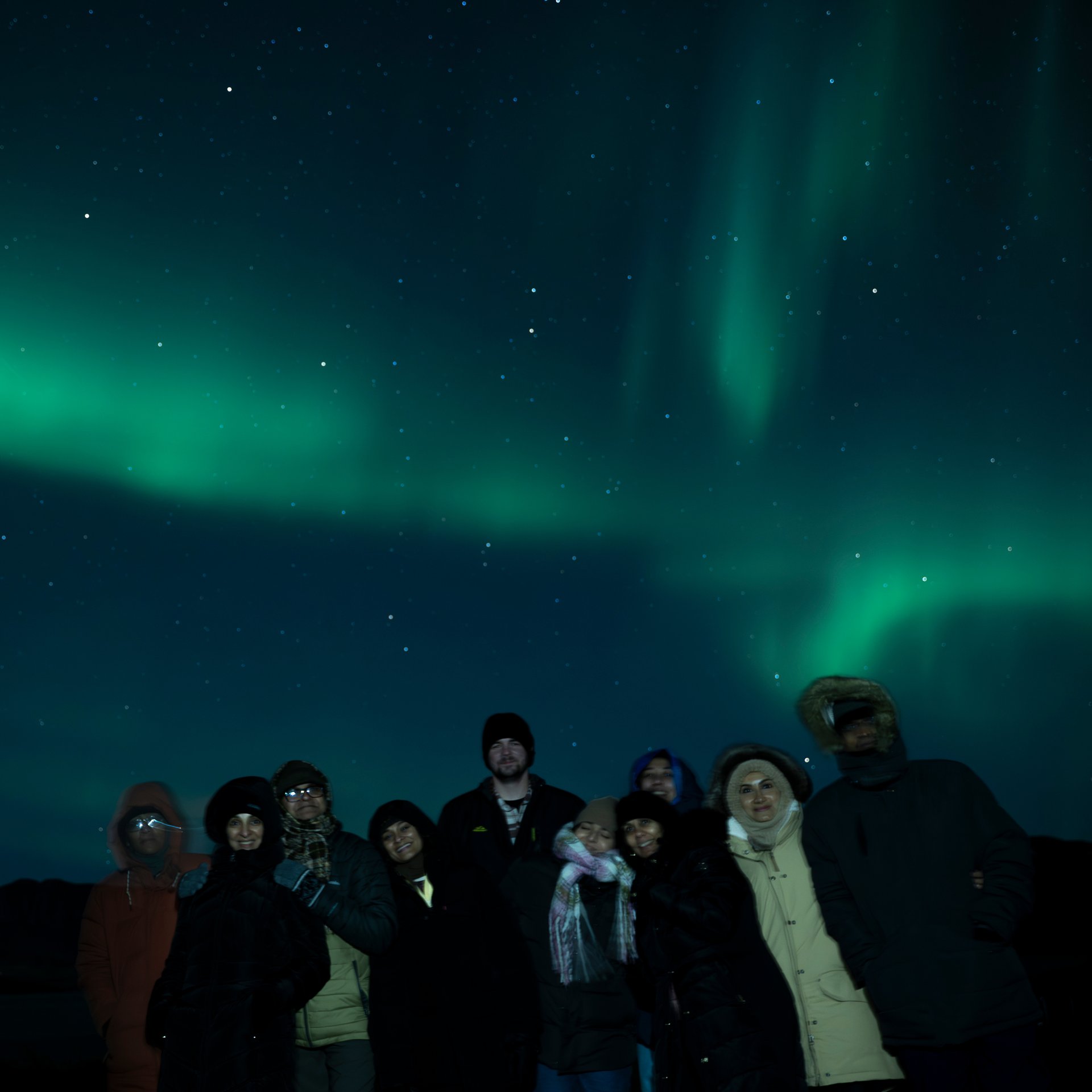 Aurora Borealis with silhouetted Icelandic terrain