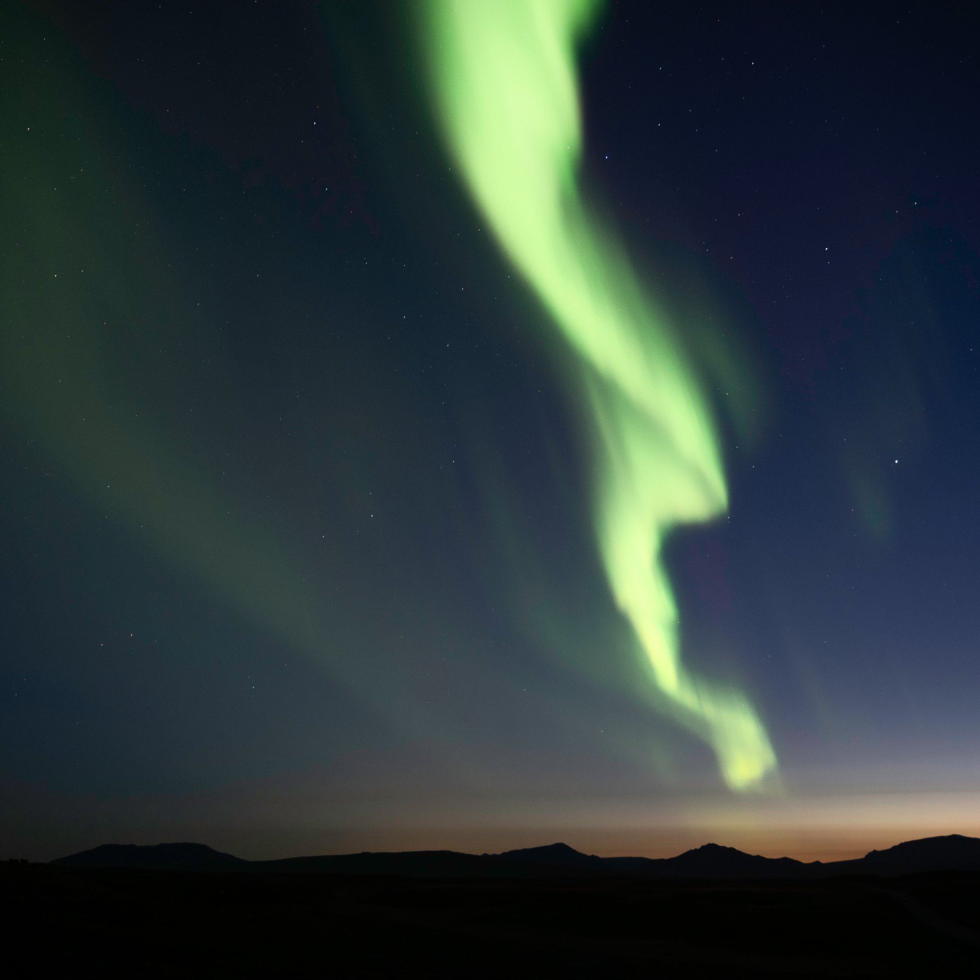 Aurora Borealis with church and landscape silhouette