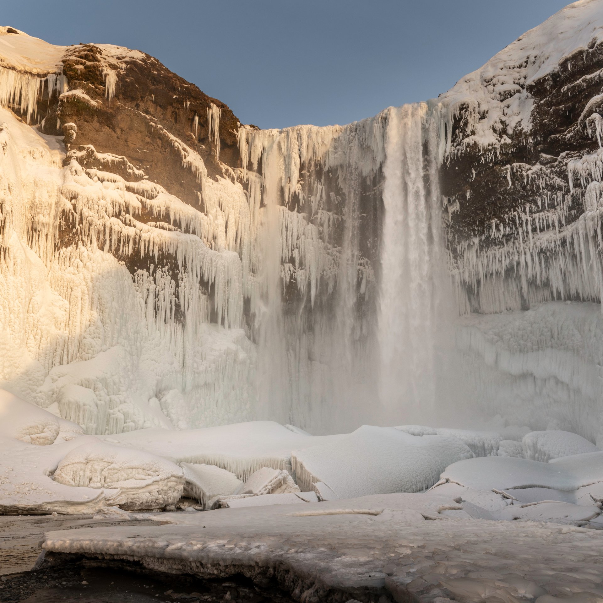 Black sand beach with powerful ocean waves