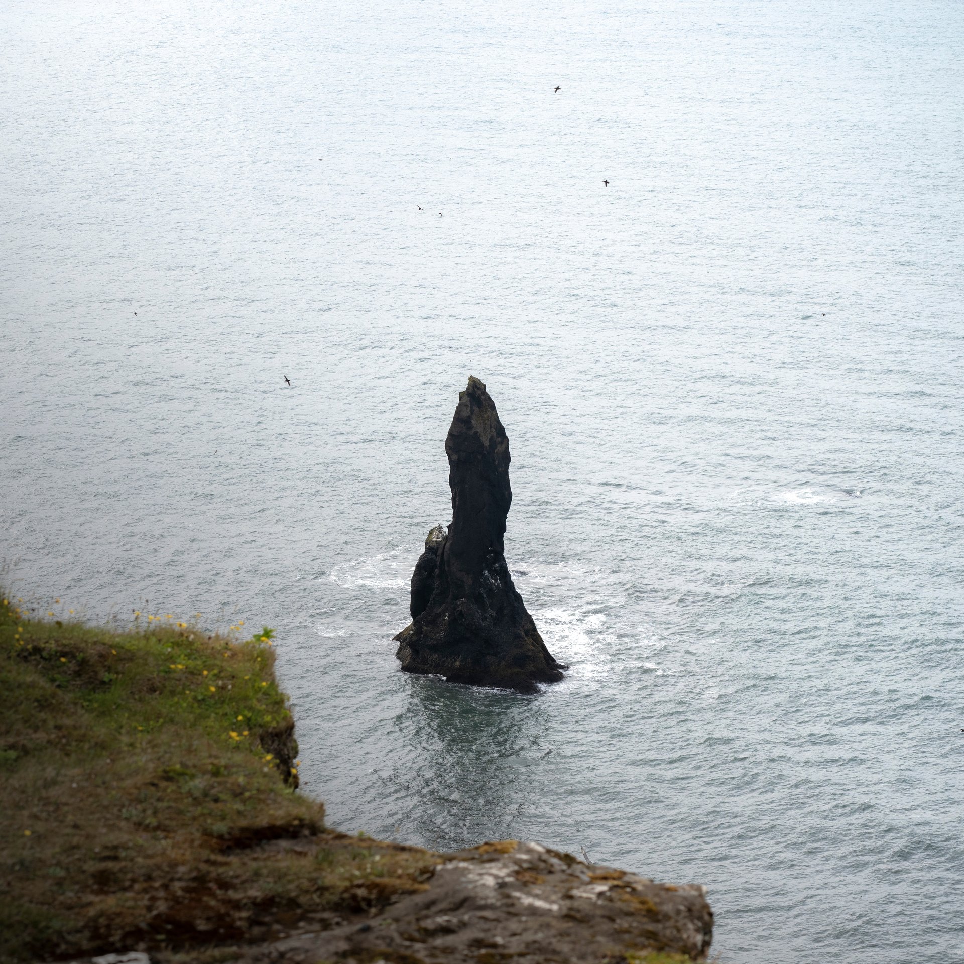 Dramatic Atlantic waves crashing on volcanic black sand