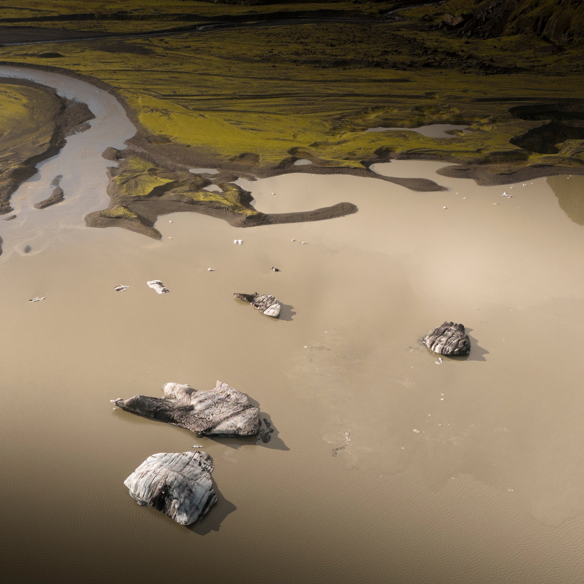 Glacier edge meeting volcanic rock formations