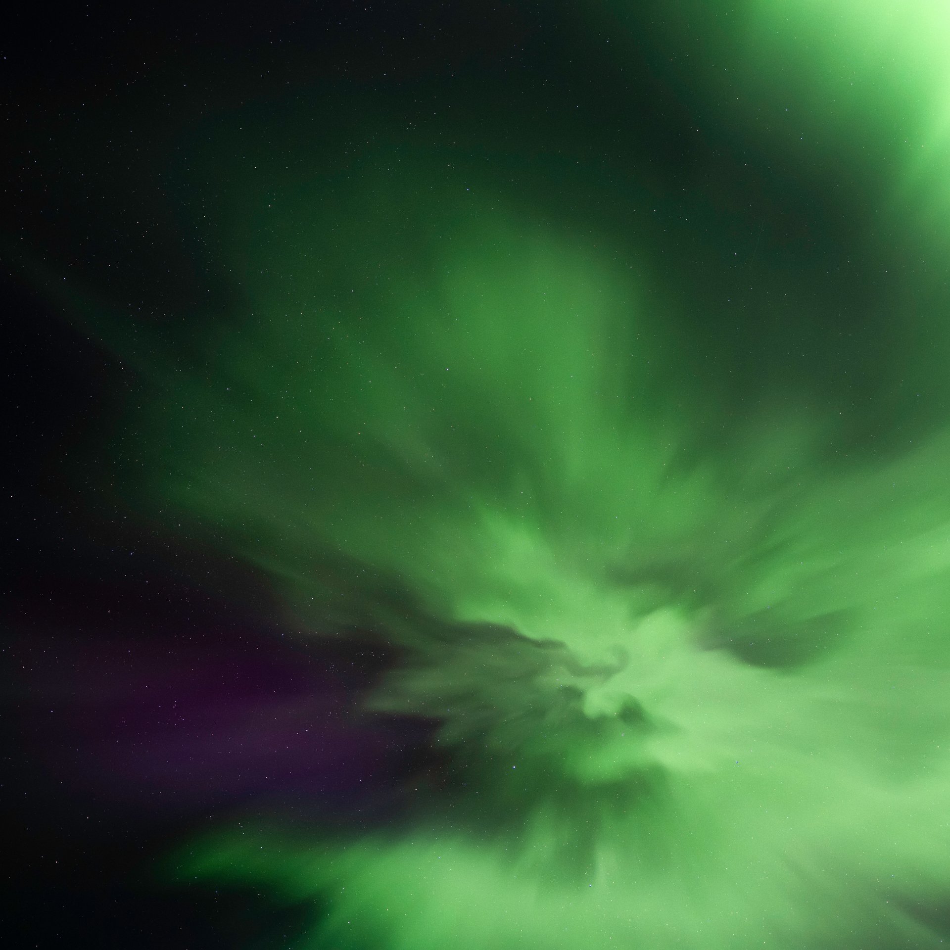 Northern Lights Aurora Borealis visible in dark sky location away from city lights