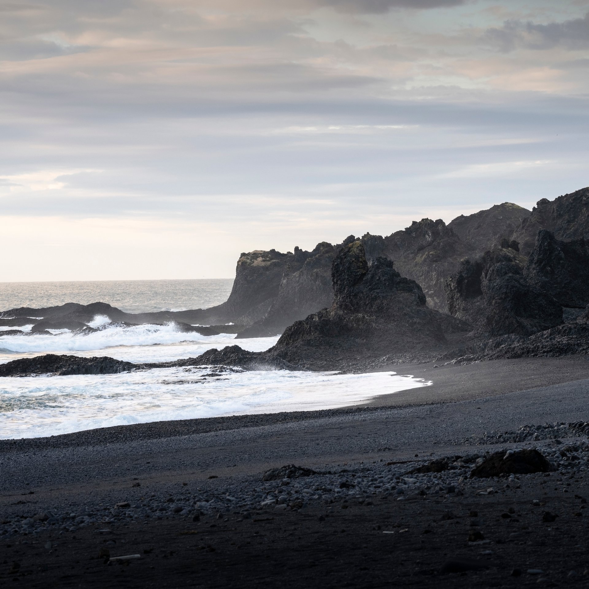 Black sand beach at Djúpalónssandur with dramatic lava formations and shipwreck remains