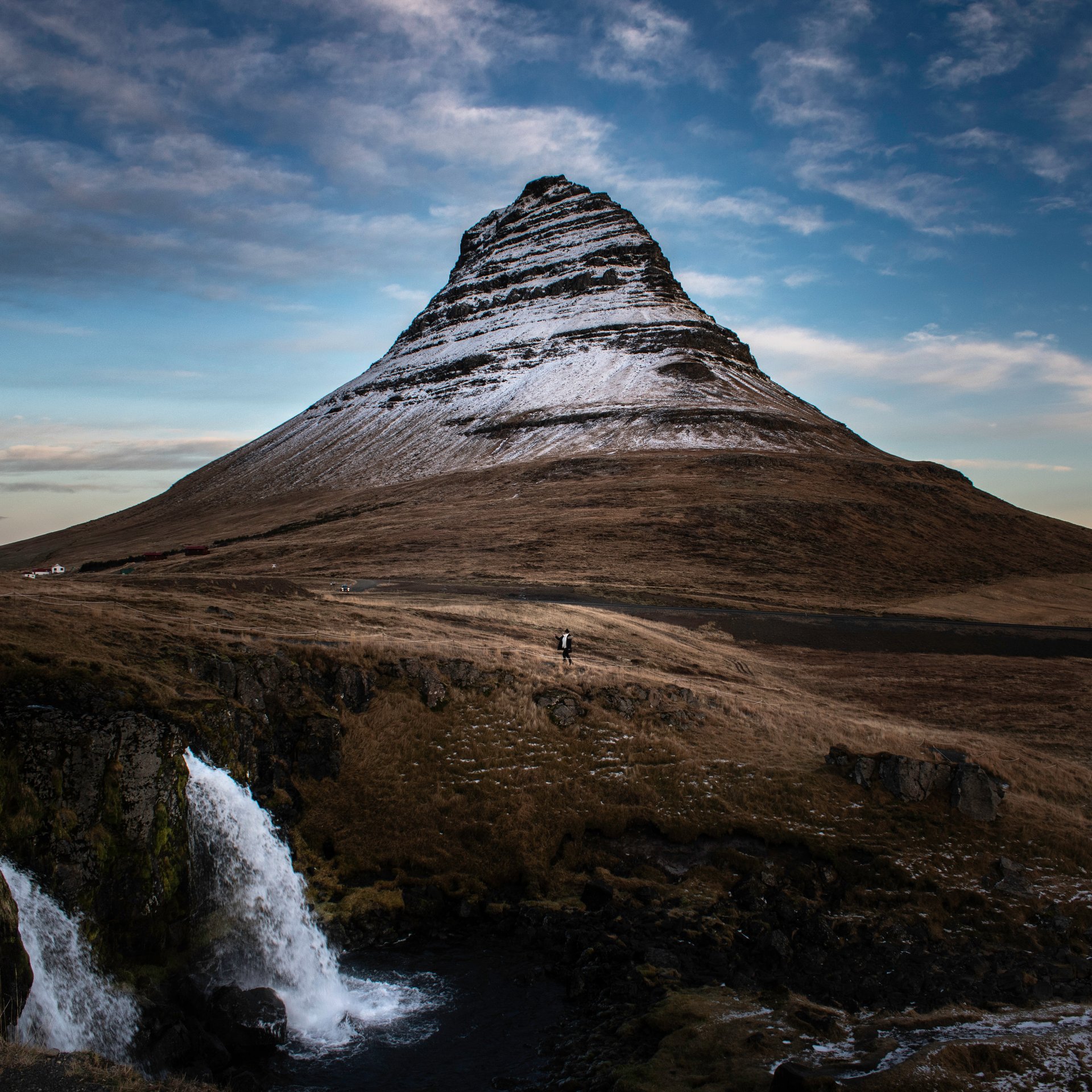 Iconic Kirkjufell mountain with Kirkjufellsfoss waterfall in foreground, Snæfellsnes Peninsula