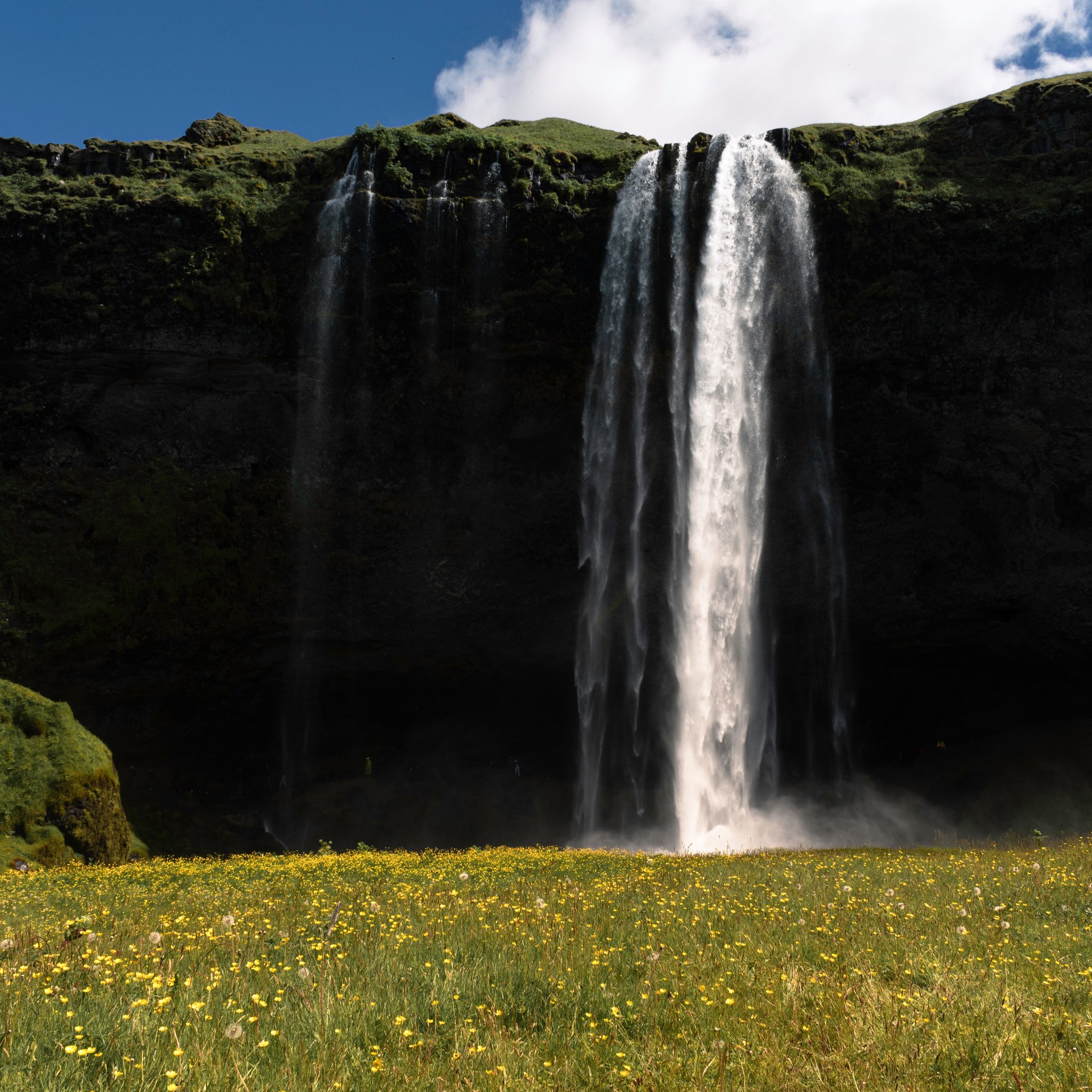 Seljalandsfoss waterfall with path behind the cascading water