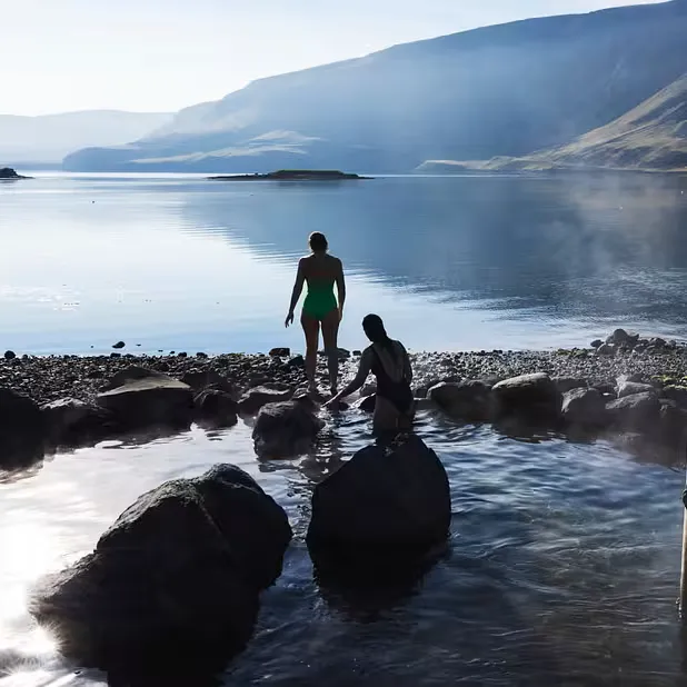 Hvammsvík geothermal hot springs with ocean views and dramatic coastal scenery
