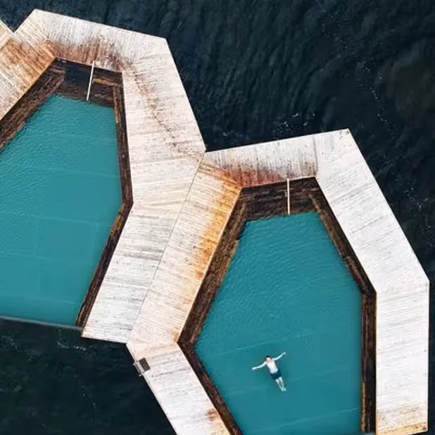 Vök Baths floating geothermal pools on lake with mountain views