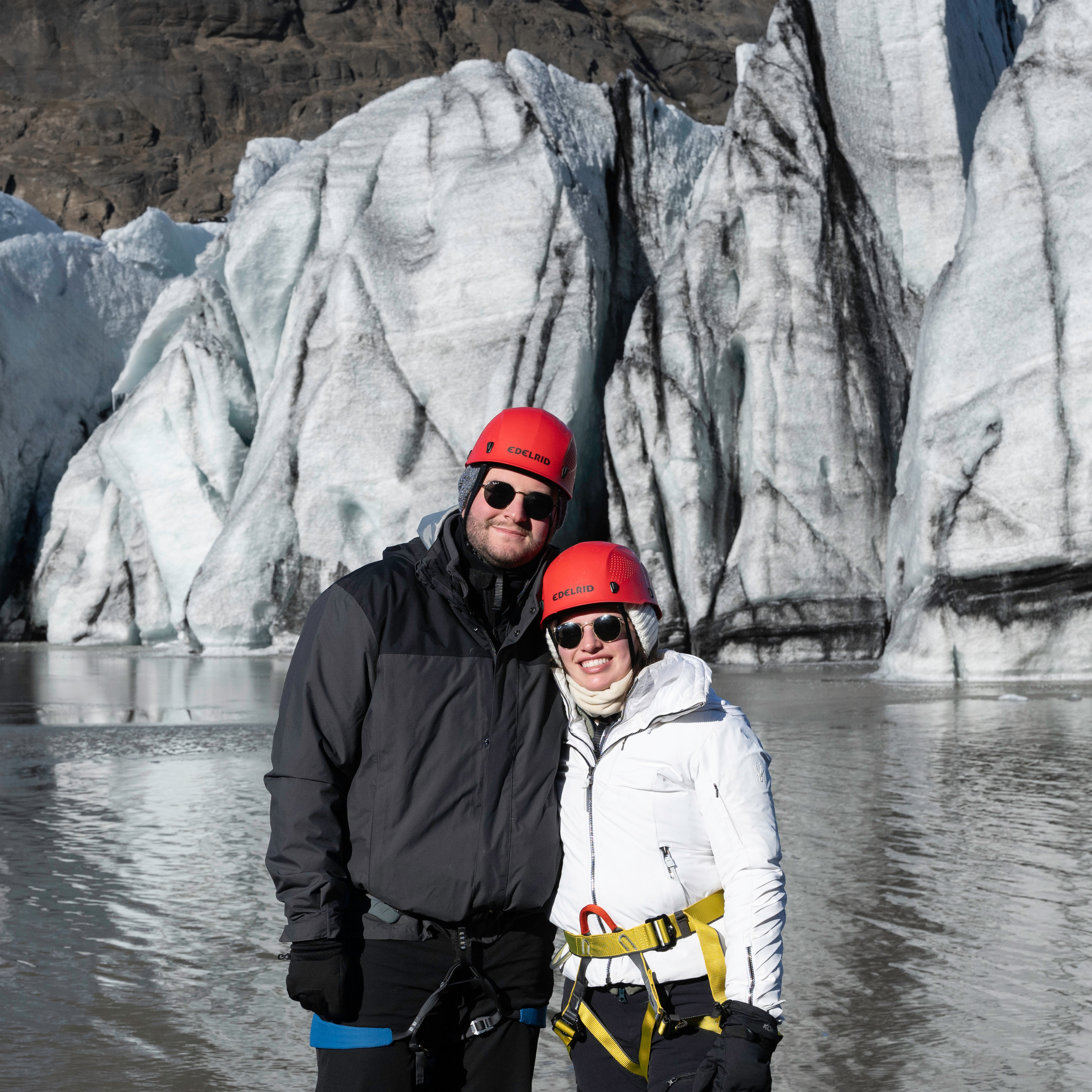 Peering into a deep blue crevasse during the glacier hiking adventure