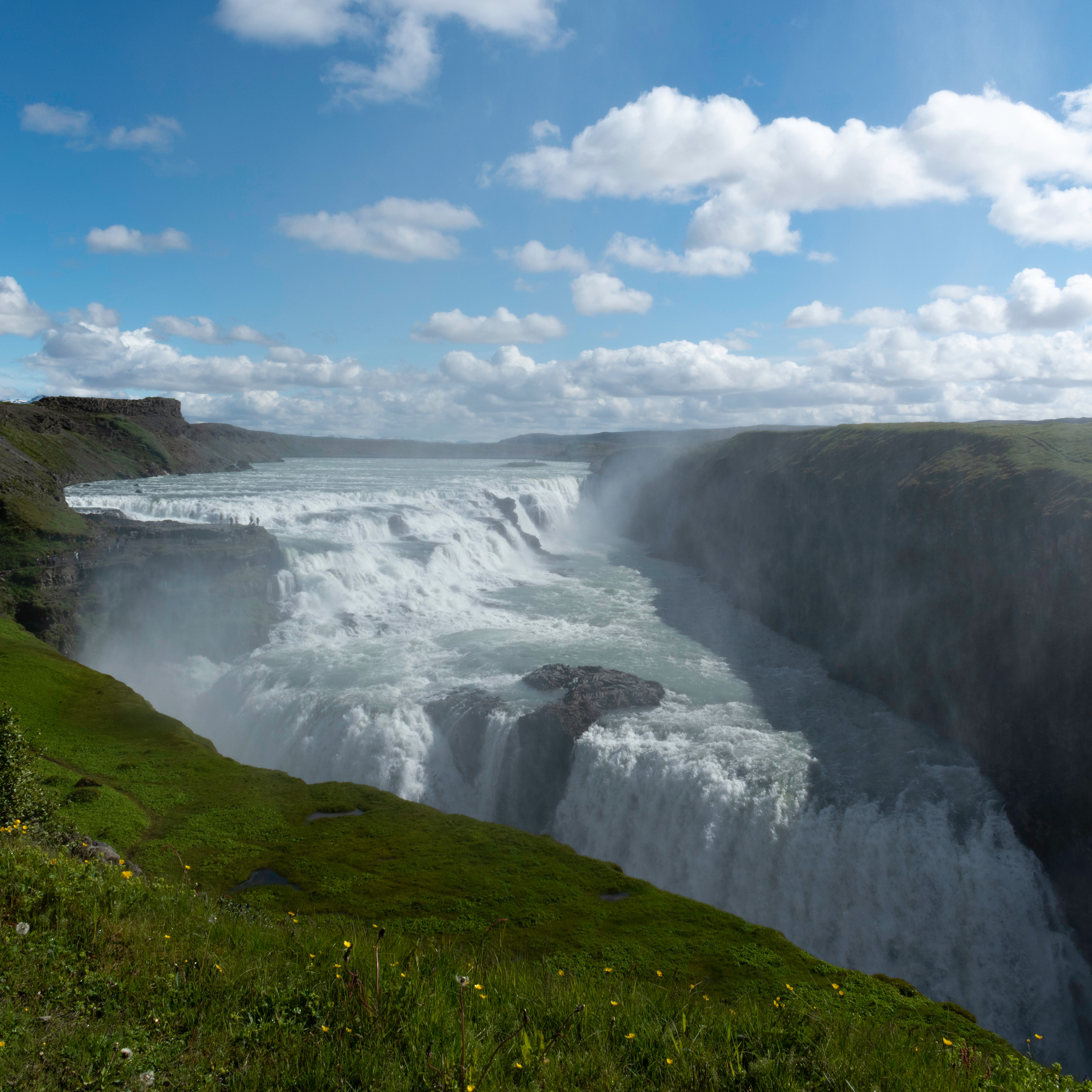 Watching Strokkur geyser erupt on a private Golden Circle day tour